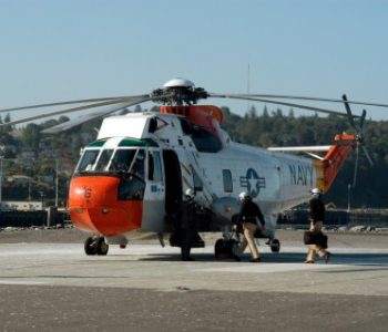 A search and rescue helicopter parked ion the runway at NS Everett Navy Base in Everett, WA