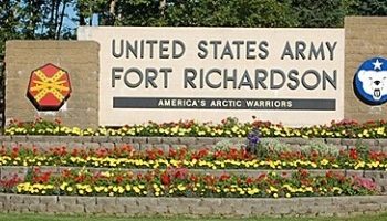 Stone welcome sign at main gate of Fort Richardson Army Base in Anchorage, AK