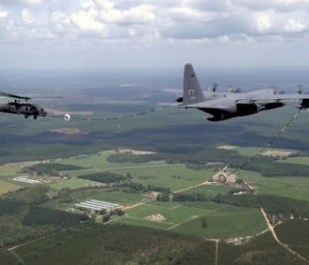 KC-130 providing in-flight refueling to a helicopter over Moody Air Force Base in Valdosta, GA
