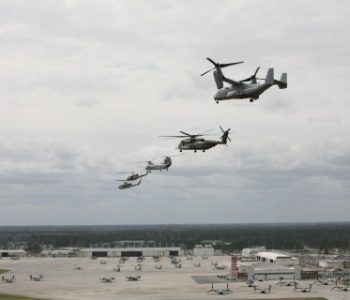 Five helicopters flying in the air toward MCAS New River Marine Corps Base in Jacksonville, NC