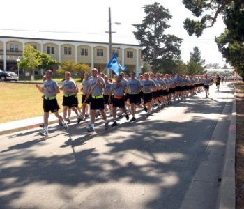 Army soldiers in group formation run at Presidio Of Monterey Army Base in Monterey, CA