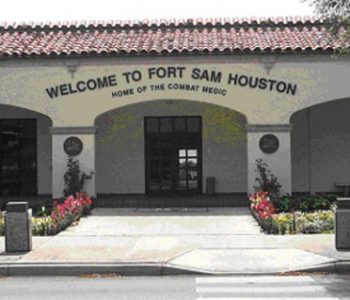 Building and welcome sign at Fort Sam Houston Army Base in San Antonio, TX