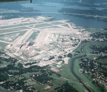 Aerial view of a large lake, landing strip, and buildings at JRB Fort Worth Navy Base in Forth Worth, TX