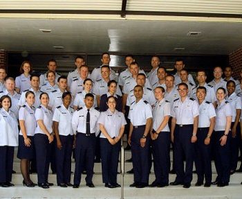 Group of Air Force Airmen posing for a photo on steps at Arnold Air Force Base in Tullahoma, TN