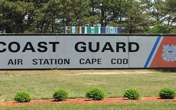 Welcome sign at the entrance to Air Station Cape Cod Coast Guard Base in Cape Cod, MA