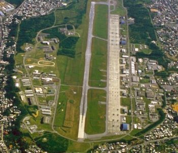 Aerial view of the runway and military installation at MCAS Futenma Marine Corps in Ginowan, Japan