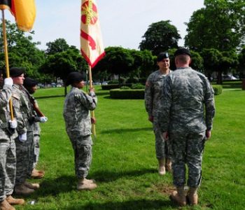 U.S. military members standing in a field in formation at USAG Heidelberg Army Base in Heidelberg, Germany