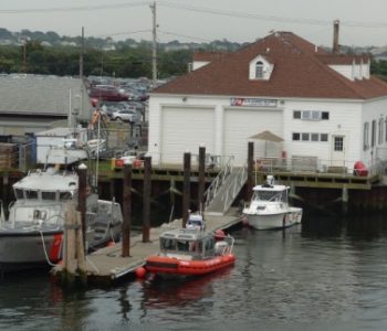 Small rescue boat tied to a pier at Station Point Judith USCG Narragansett, RHODE ISLAND