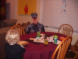 Child with Military Dad Poster at Table