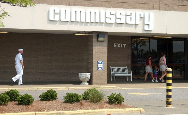 A person entering the Commissary And Post Exchange building