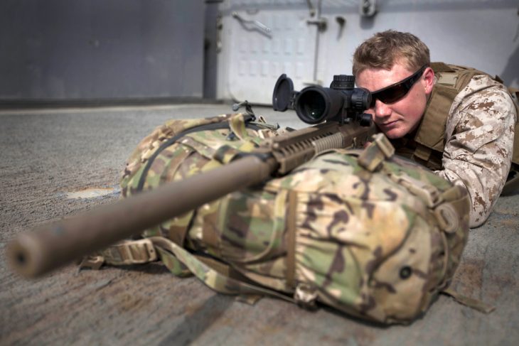 A Marine in uniform with a sniper rifle