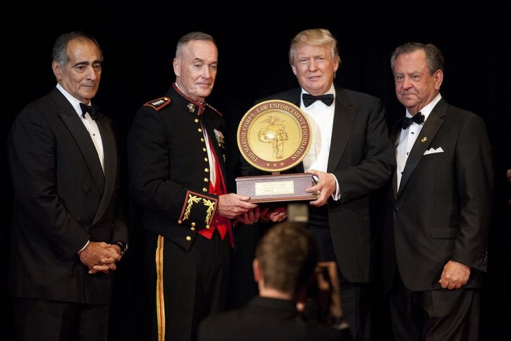 John J. Mack, Joseph F. Dunford, Jr., Donald Trump standing next to a person in a suit and tie