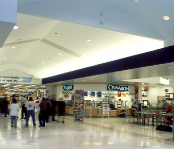 A group of people in the food court at the Fort Buchanan Commissary